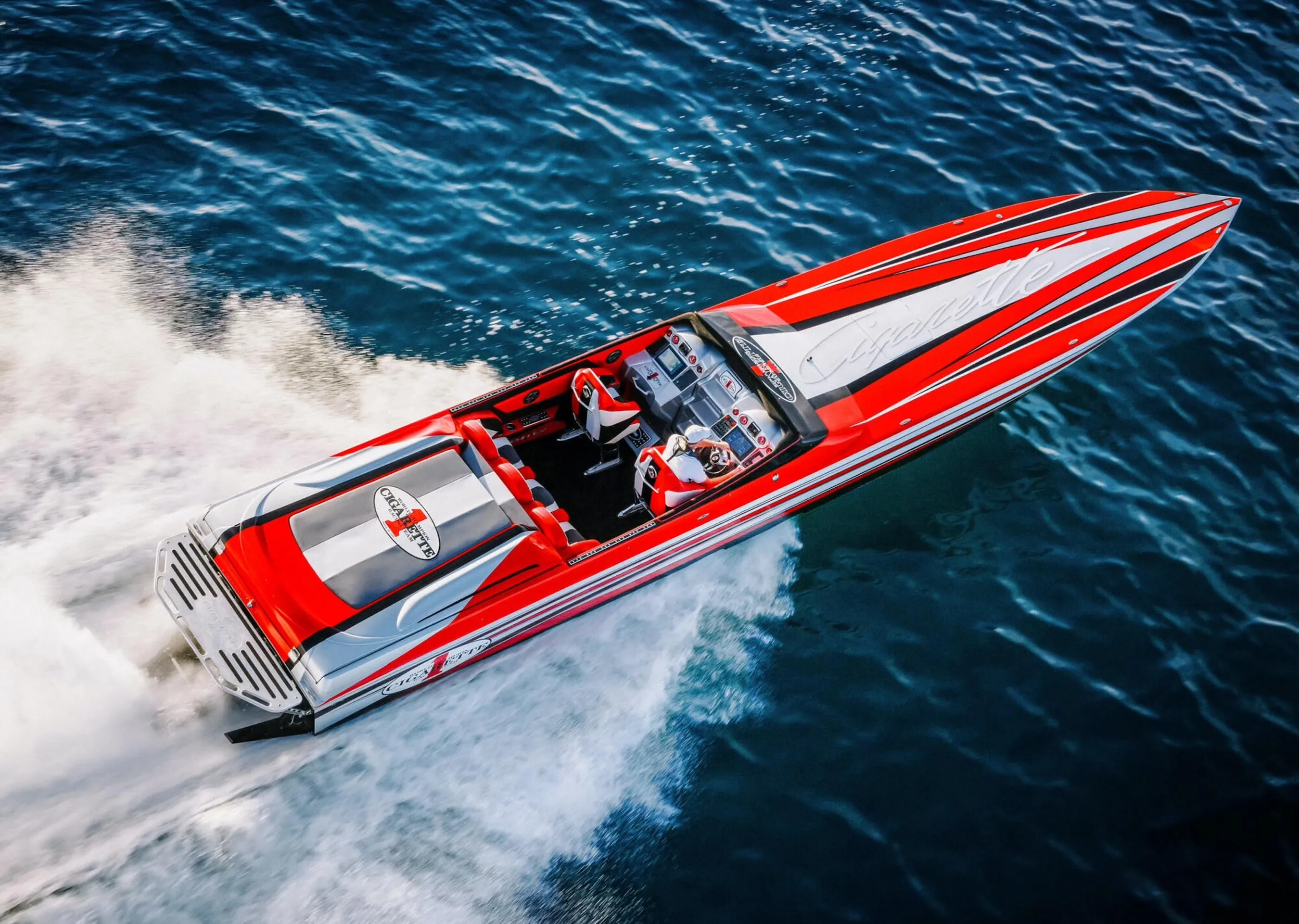 A high-performance cigarette boat cruising on the water
