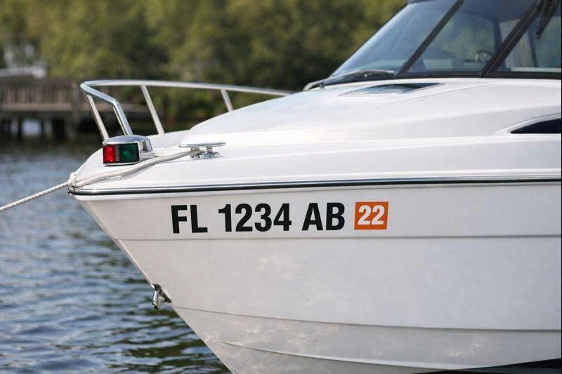 Close-up of a precision-cut boat registration number applied to a hull